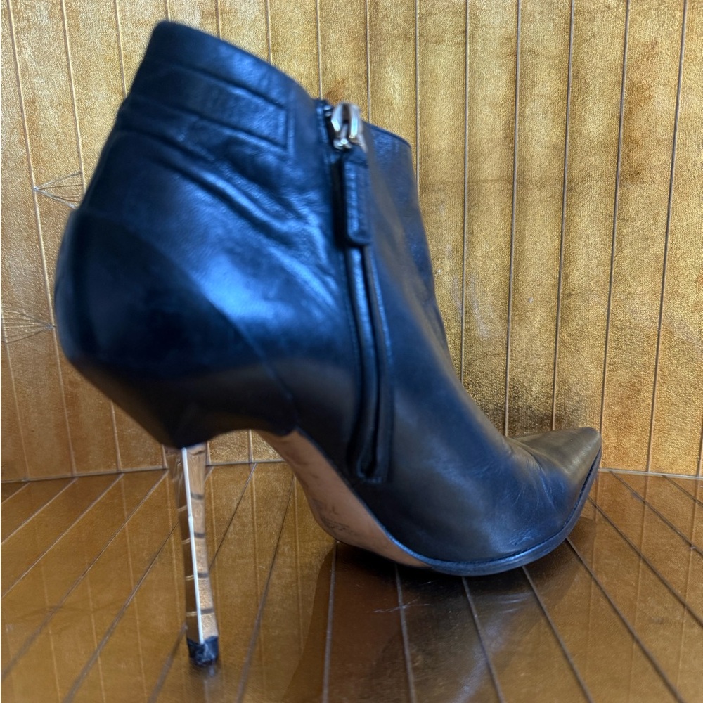Women’s Gucci, black leather ankle boots with chrome heels